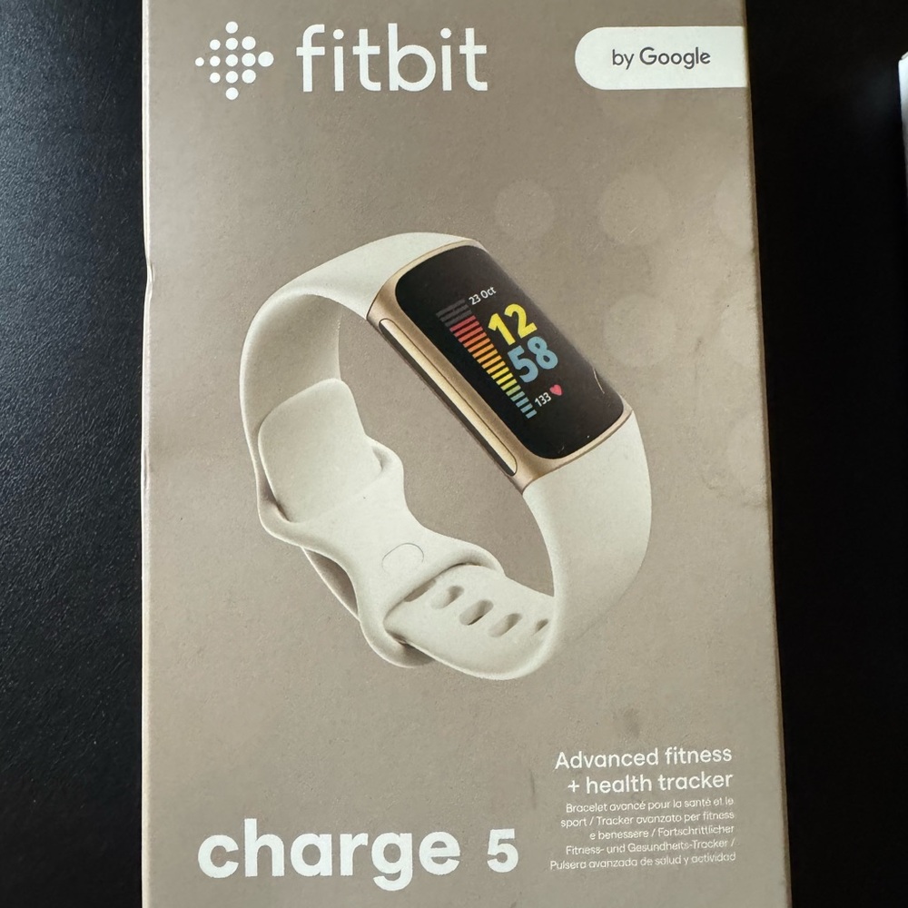 Fitbit White Smartwatch with Sleek Design and Color Display